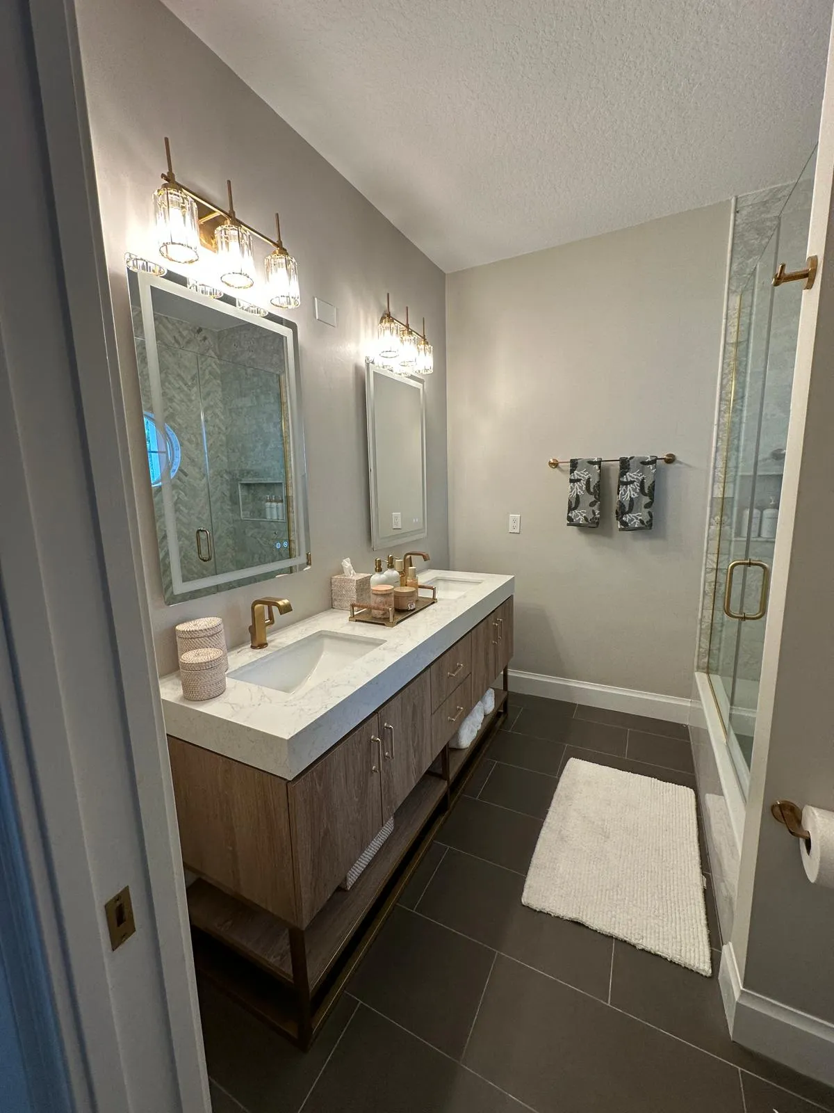 Wood double vanity bathroom remodeled by R&M Remodeling Contractor LLC in Port St Lucie, FL